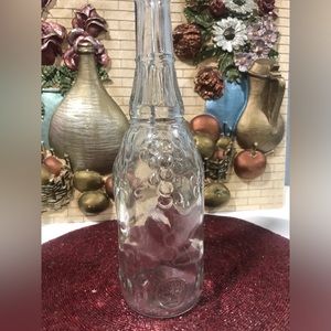 Vintage glass bottle with grape design